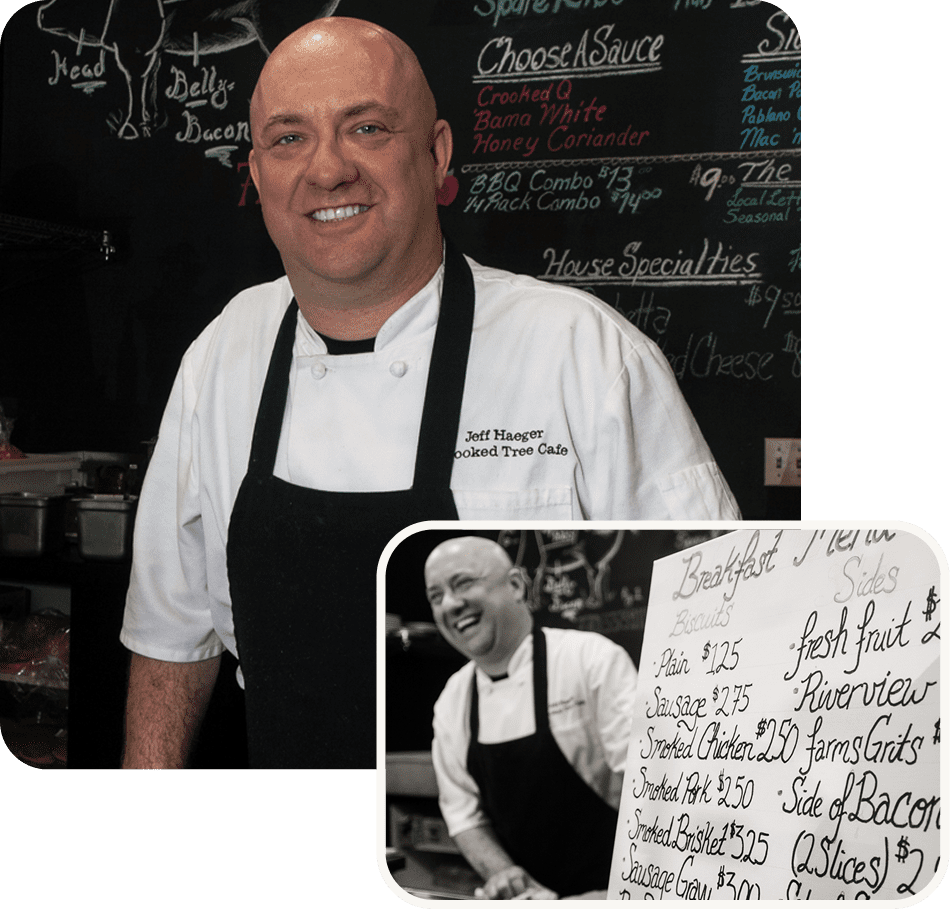 Smiling chef in a restaurant with menu and photo of himself.